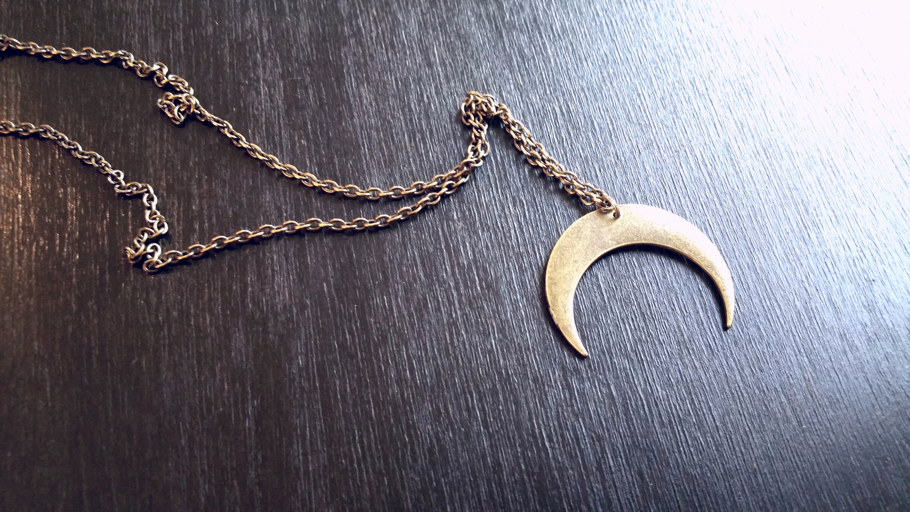 osteal crescent moon necklace